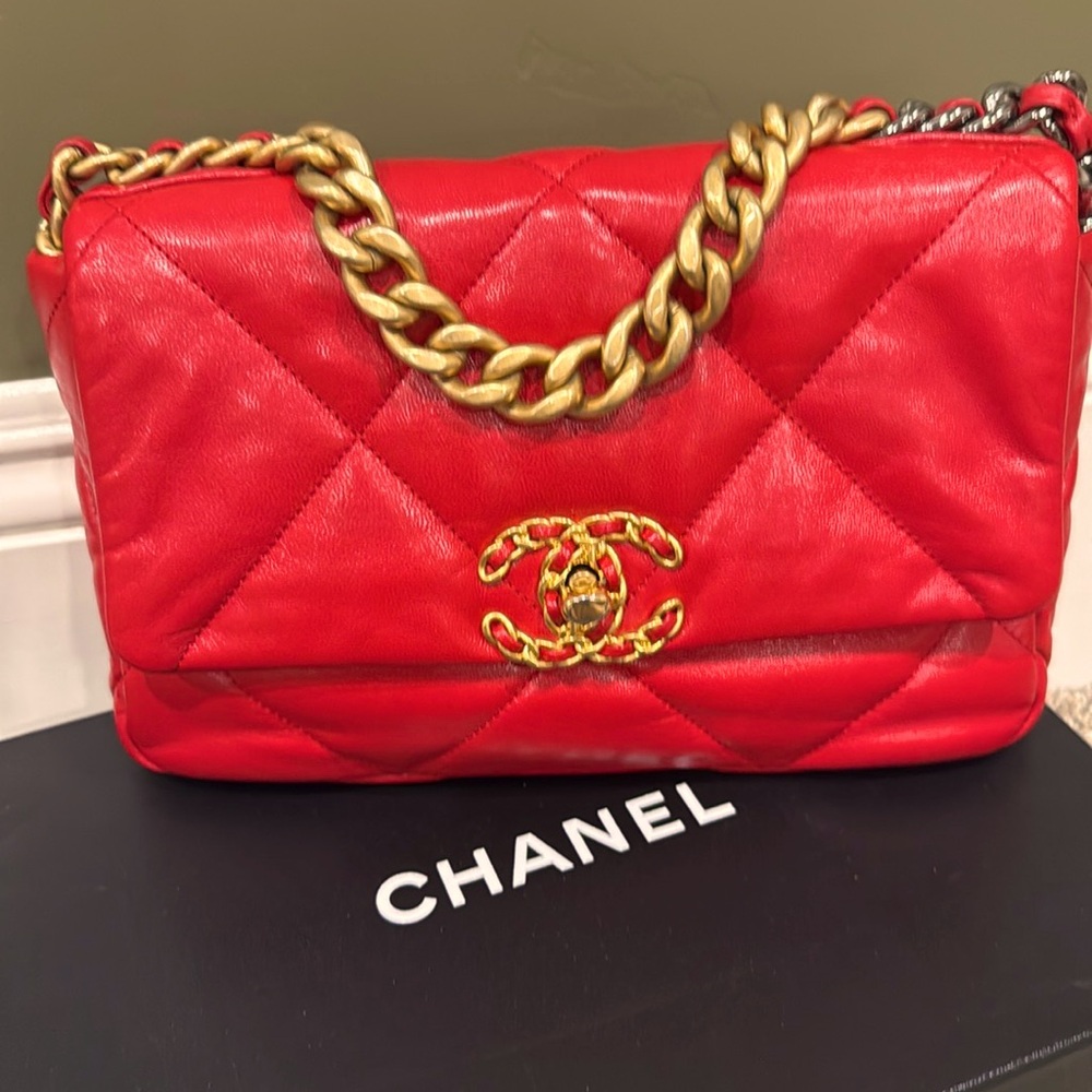 CHANEL 19 red small quilted lamb skin with two tone hardware in excellent cond